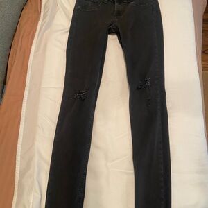 Black rag and bone jeans, small rips in the knees.